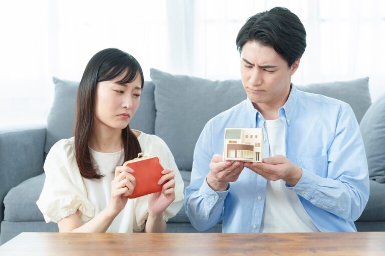 Young,Asian,Couple,With,Worried,Expression,Wondering,Whether,To,Buy