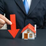 The,Businessman,Notes,A,Fall,In,Housing,Prices.,Symbol,Of