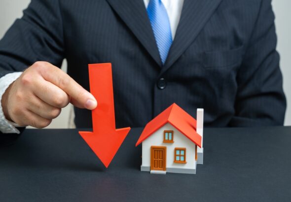 The,Businessman,Notes,A,Fall,In,Housing,Prices.,Symbol,Of