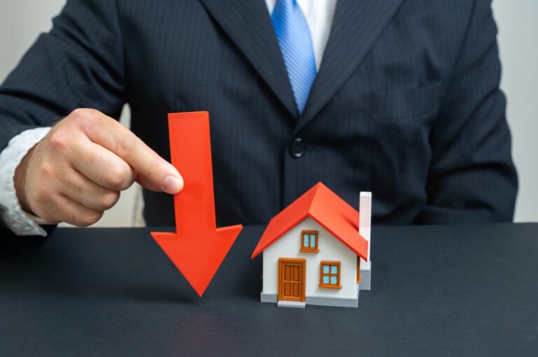 The,Businessman,Notes,A,Fall,In,Housing,Prices.,Symbol,Of