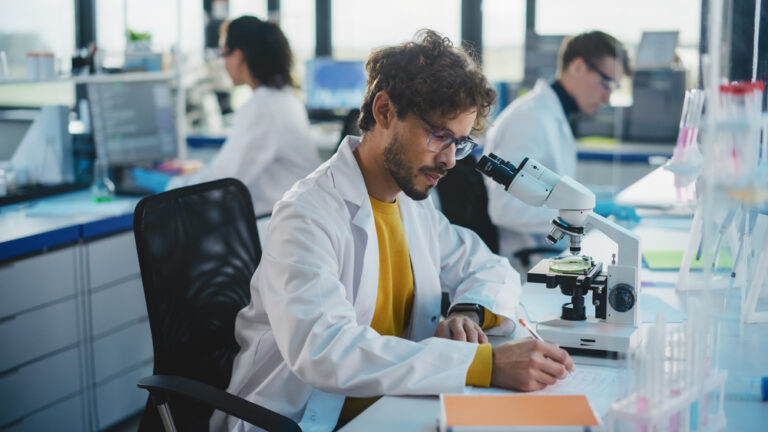 Medical,Science,Laboratory:,Handsome,Latin,Scientist,Is,Using,Microscope,For