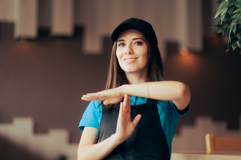 Fast,Food,Employee,Making,A,Break,Time,Gesture.,Restaurant,Worker