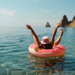 Summer,Vacation,Woman,In,Hat,Floats,On,An,Inflatable,Donut
