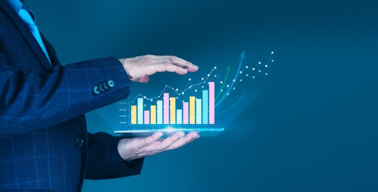 Businessman',Hand,Supports,A,Rising,Graph,On,A,Tablet,,Representing