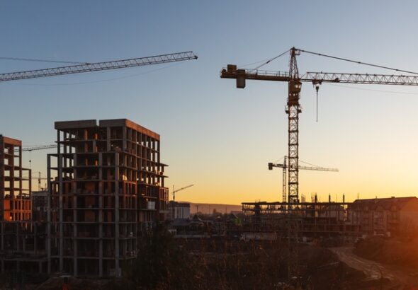 Construction,Boom,In,Western,Ukraine.,A,Construction,Crane,Silhouetted,Against