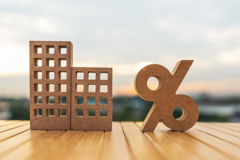 Real,Estate,Property,Models,With,A,Percentage,Sign,On,A