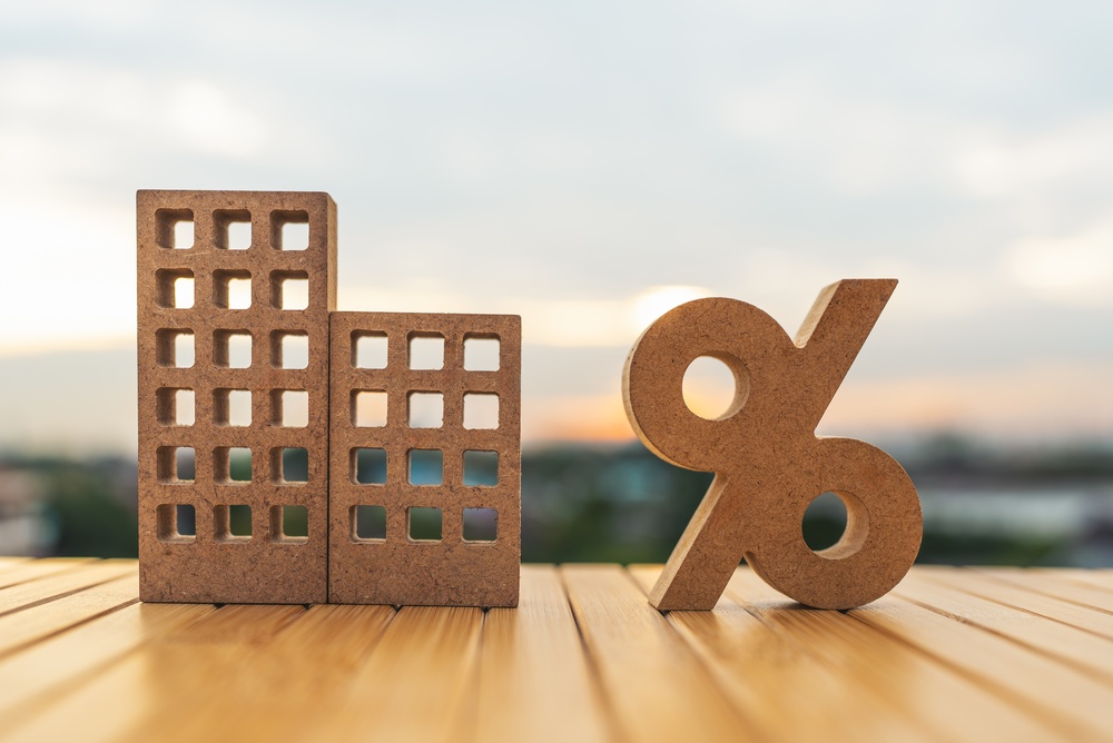 Real,Estate,Property,Models,With,A,Percentage,Sign,On,A