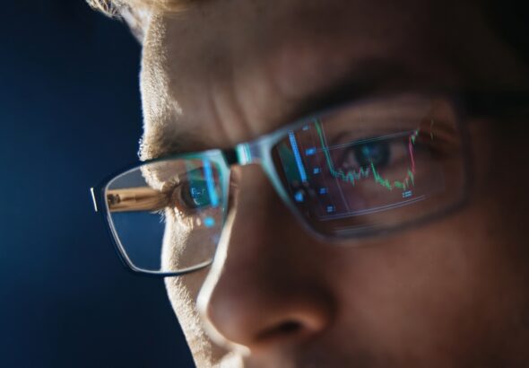 Close,Up,View,Of,Focused,Trader,Wears,Eyeglasses,Looking,At