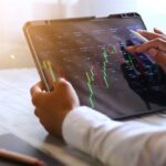 Asian,Businessman,Checking,Stock,Market,Data,,Stock,Market,Application,For