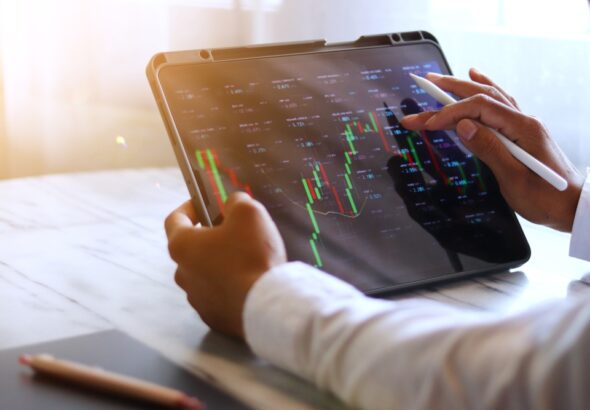 Asian,Businessman,Checking,Stock,Market,Data,,Stock,Market,Application,For