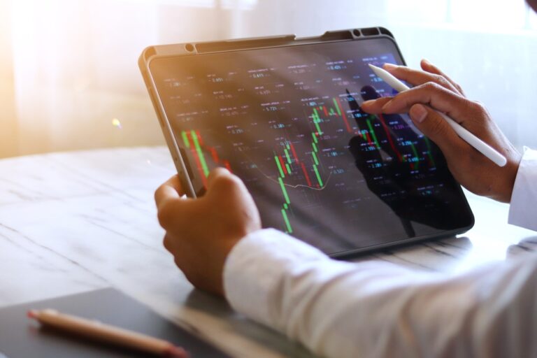 Asian,Businessman,Checking,Stock,Market,Data,,Stock,Market,Application,For