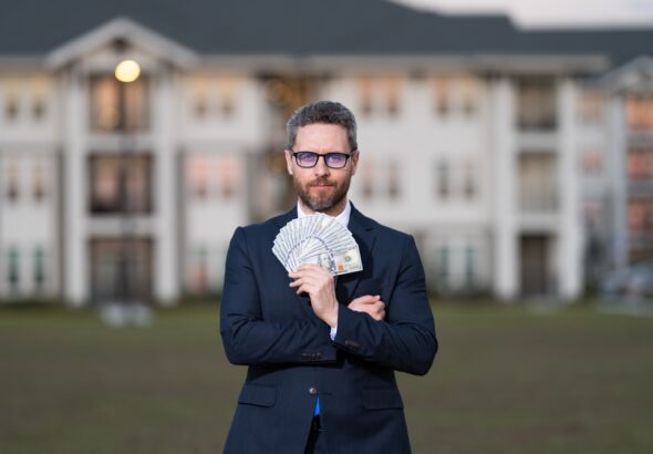 Successful,Realtor,In,Suit,With,Money,Dollar.,House,Owner,Hold