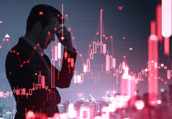 Silhouette,Of,Stressed,Man,Against,Red,Market,Chart,In,Clean