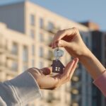 Close,Up,Of,Female,Real,Estate,Owner,Handing,Over,House