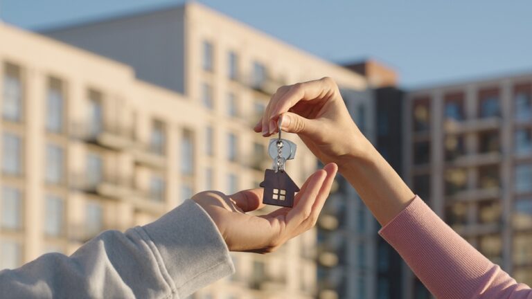 Close,Up,Of,Female,Real,Estate,Owner,Handing,Over,House