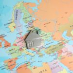 Metal,House,Model,On,World,Map,,Above,View.,Accommodation,Search