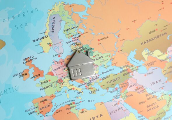 Metal,House,Model,On,World,Map,,Above,View.,Accommodation,Search