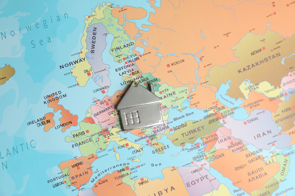 Metal,House,Model,On,World,Map,,Above,View.,Accommodation,Search