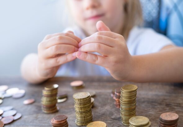 Small,Child,Makes,Roof,Over,Metal,Coins,,Kid,Puts,Euro