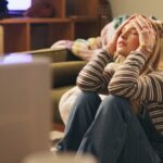 Woman,,Stress,And,Moving,On,Floor,In,House,With,Boxes,
