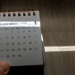 Hand,Holding,A,Small,Spiral,Desk,Calendar,Showing,September,2026