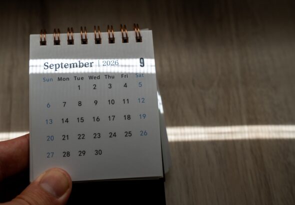Hand,Holding,A,Small,Spiral,Desk,Calendar,Showing,September,2026