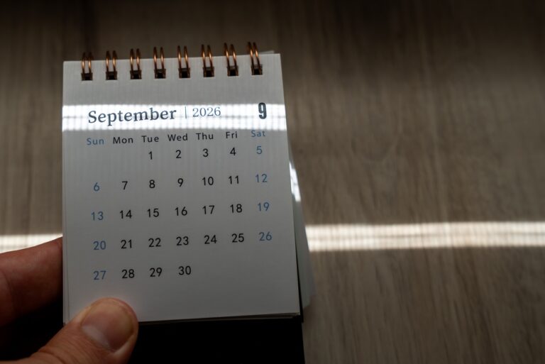 Hand,Holding,A,Small,Spiral,Desk,Calendar,Showing,September,2026