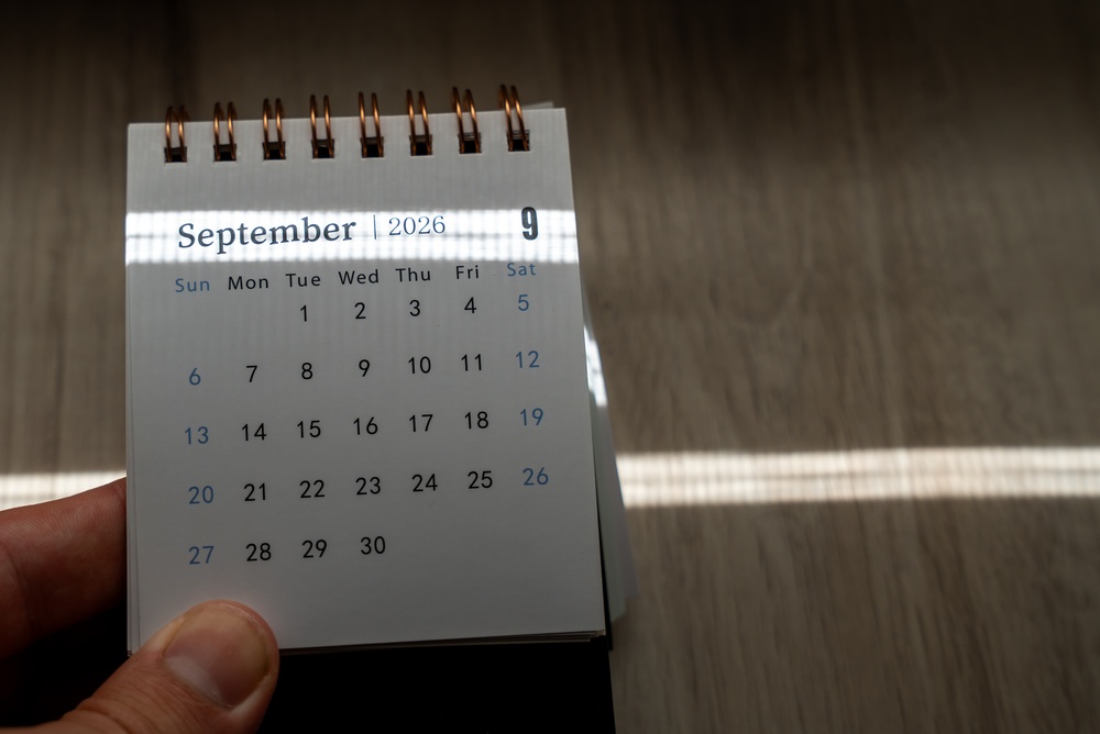 Hand,Holding,A,Small,Spiral,Desk,Calendar,Showing,September,2026