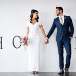 Smile,,Bride,And,Groom,Holding,Hands,In,New,Home,For